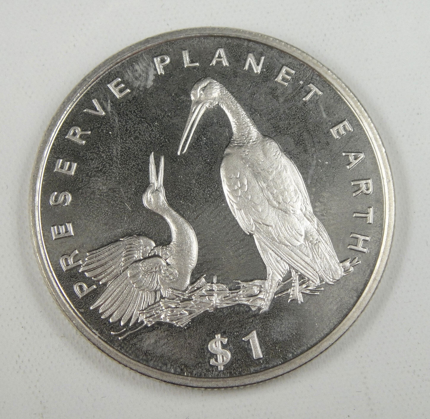 Liberia Commemorative Coin $1 Almost Unc, Preserve Planet Earth, Storks